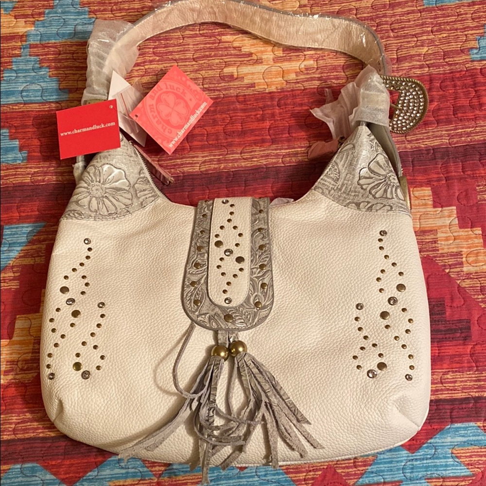 Charm and Luck Cream Shoulder Bag with Tassel Accents